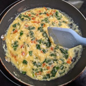 Stirring scrambled eggs