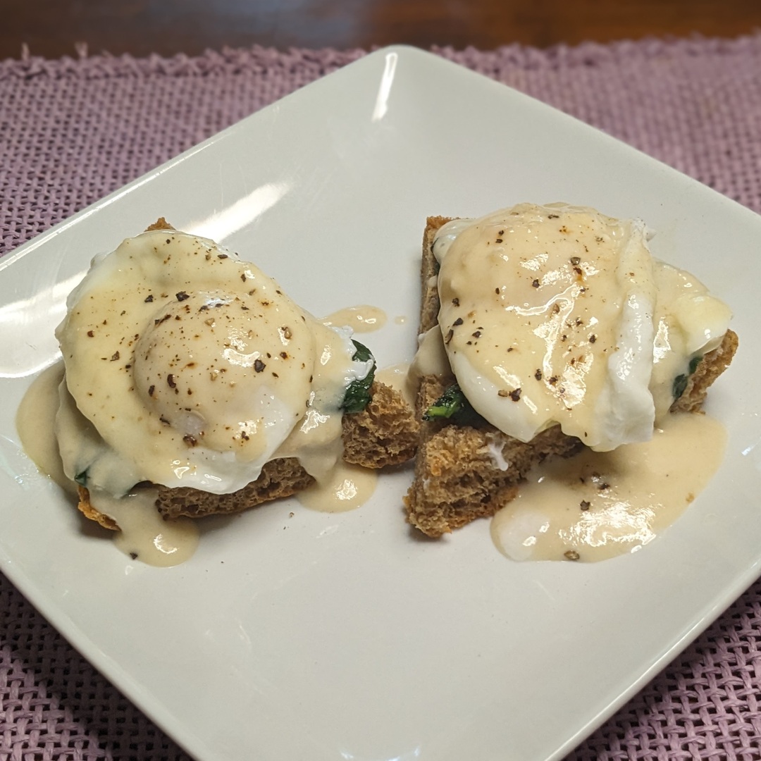 Eggs Florentine with heart healthy mornay sauce on whole wheat focaccia